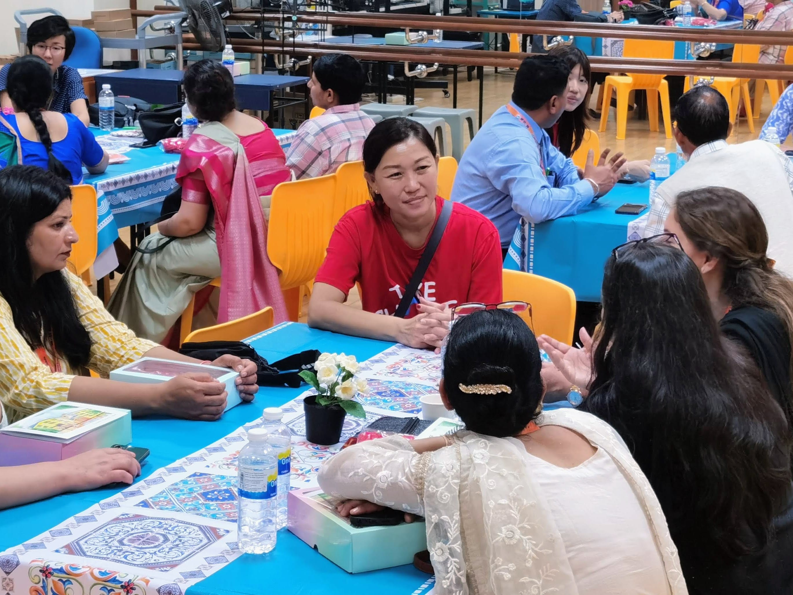 Teachers from Lakeside Primary and guests gathered in groups engaged in meaningful discussions